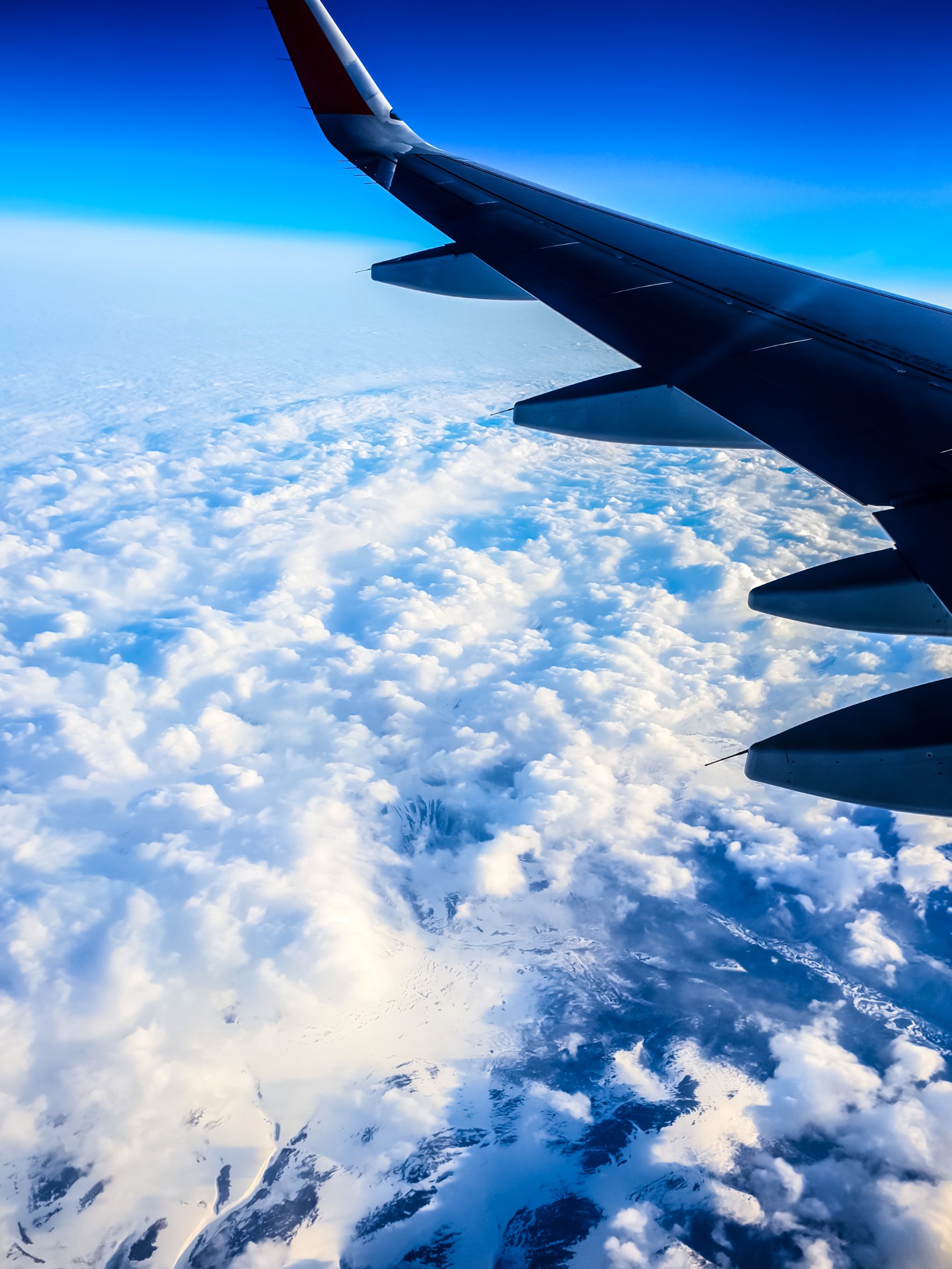 Photo of United Airlines airplane wing in flight